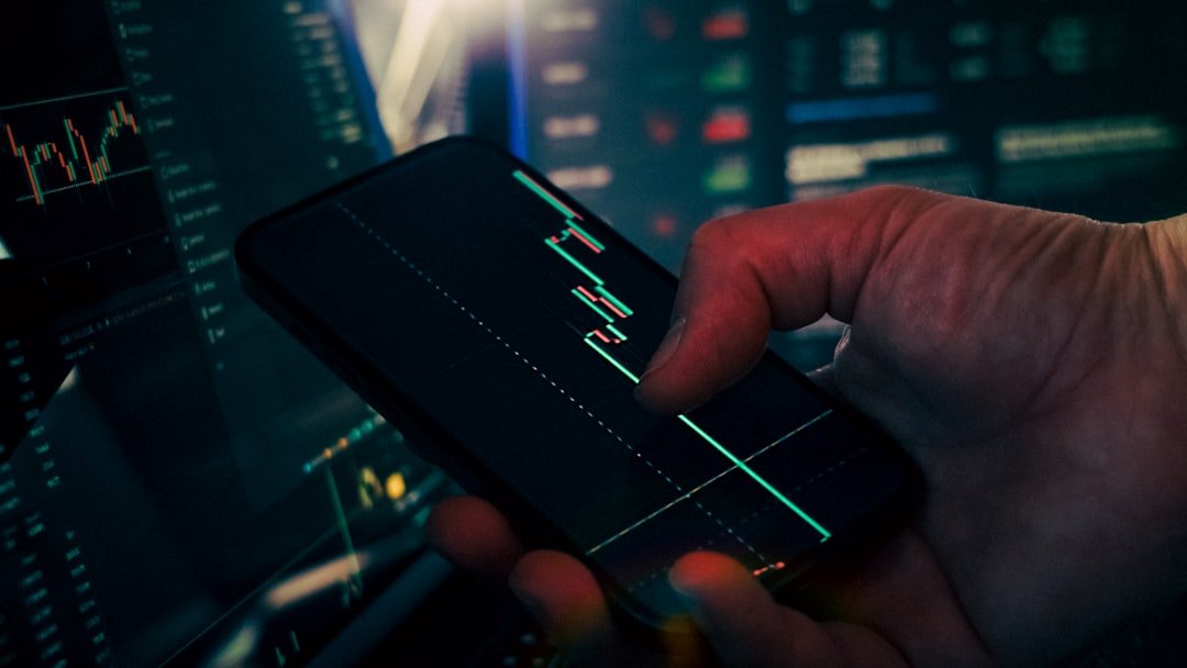 agentic AI SaaS pricing - Trader analyzing stock market data on smartphone and phone