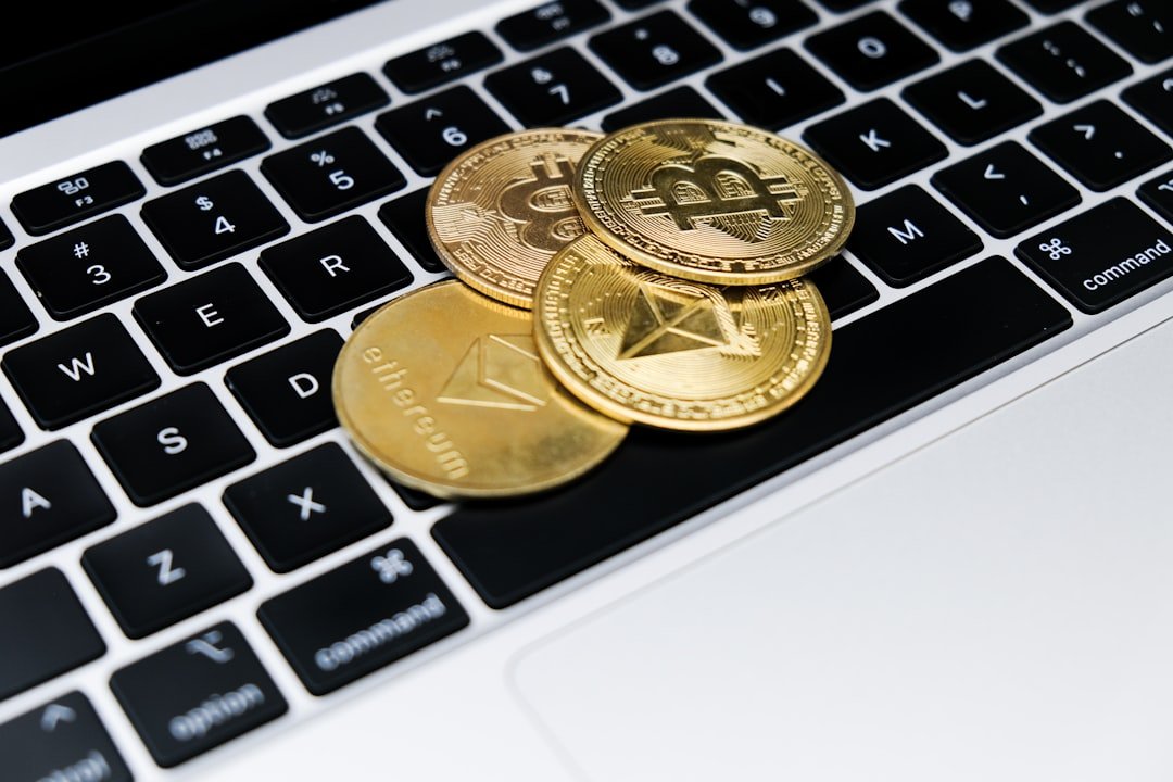 Ethereum cryptocurrency trading - a group of gold coins on a keyboard