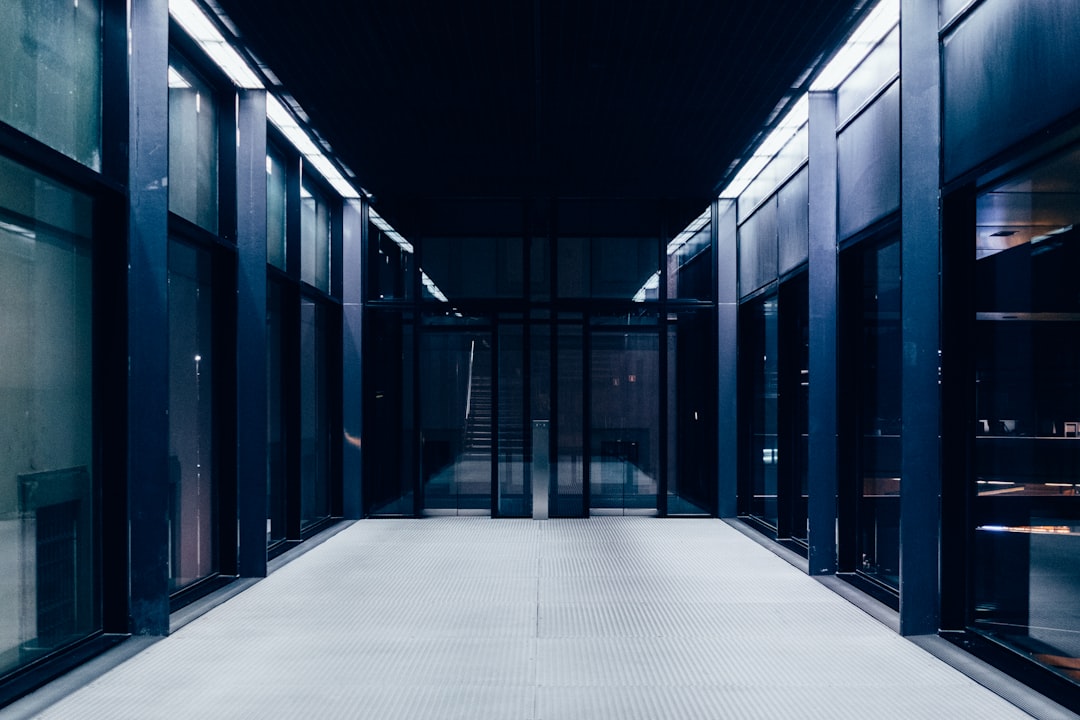Nebius AI data center 2026 - a long hallway with glass doors leading to another room