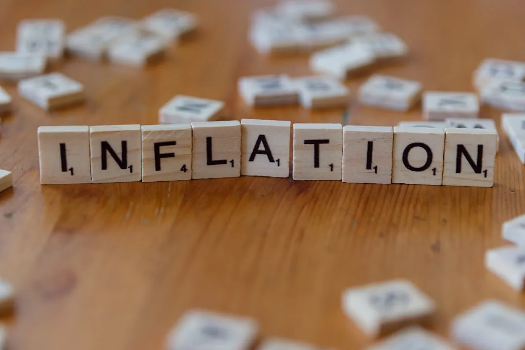 Inflation scrabble tiles illustrating sticky core PCE and the case for rate hikes