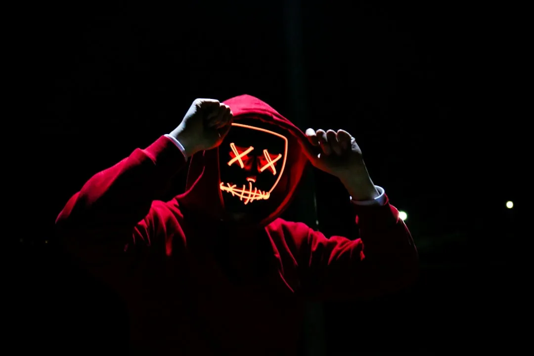 Hooded figure symbolizing the single operator behind the AI hacking campaign