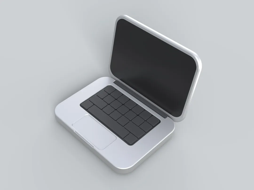 an open laptop computer sitting on top of a table