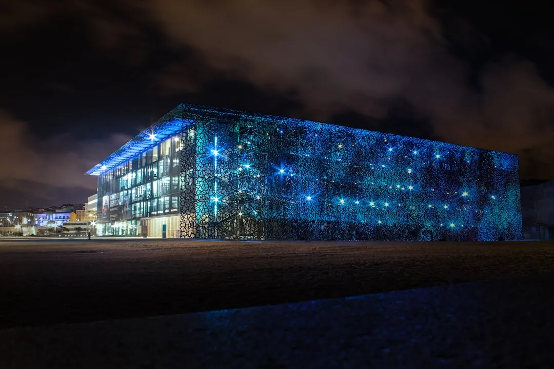 Data center exterior — global AI infrastructure build-out extending beyond GPUs into analog and power semiconductors
