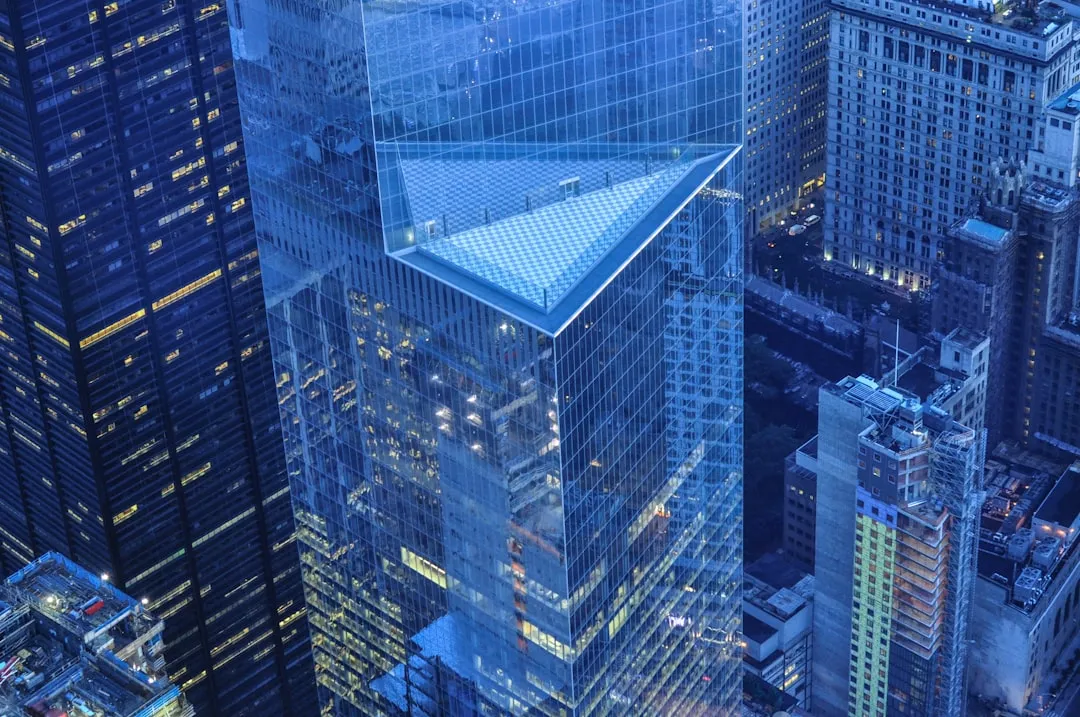 Financial district skyline symbolizing the gap between boardroom sentiment and Wall Street
