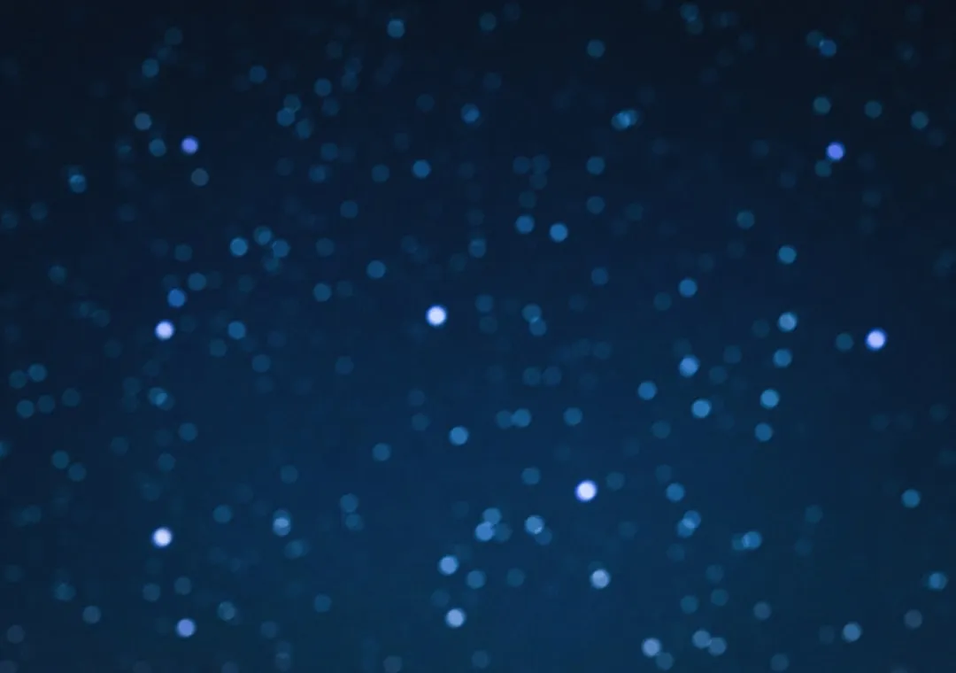 a blurry photo of a night sky with stars